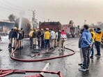 Firefighters extinguish the fire at the site of the accident after a truck loaded with a chemical collided with some other vehicles and caught fire on the Jaipur-Ajmer Highway, in Jaipur, Friday, Dec. 20, 2024. Firefighters extinguish the fire at the site of the accident after a truck loaded with a chemical collided with some other vehicles and caught fire on the Jaipur-Ajmer Highway, in Jaipur, Friday, Dec. 20, 2024.