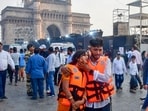 Passengers after being rescued in a joint operation by the Indian Navy and Indian Coast Guard after a ferry capsized off Mumbai coast.