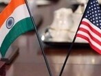 The flags of the United States and India adorn a conference table during a meeting between The flags of the United States and India adorn a conference table during a meeting between