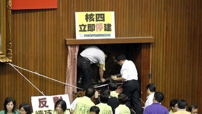 Politicians from Lai's Democratic Progressive Party had occupied the podium of the parliament's main chamber since Thursday night and barricaded themselves inside.(AP Photo) 