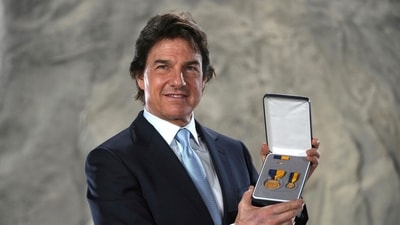 Tom Cruise poses with the Navy Distinguished Public Service Award received from The United States Secretary of the Navy Carlos Del Toro, at the Longcross South Studios, in Runnymede, Surrey, England, Tuesday, Dec. 17, 2024. AP/PTI (AP) Tom Cruise poses with the Navy Distinguished Public Service Award received from The United States Secretary of the Navy Carlos Del Toro, at the Longcross South Studios, in Runnymede, Surrey, England, Tuesday, Dec. 17, 2024. AP/PTI (AP)