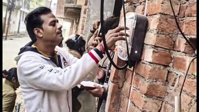 An officer checks electricity reading at the residence of Samajwadi Party MP Zia-ur Rehman Barq, in Sambhal. (PTI Photo) An officer checks electricity reading at the residence of Samajwadi Party MP Zia-ur Rehman Barq, in Sambhal. (PTI Photo)