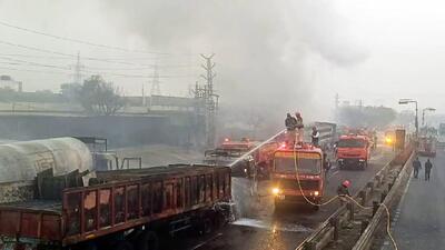 Firefighters extinguish the fire at the site of the accident after a massive fire started due to a collision between a gas tanker and multiple vehicles near a petrol pump on the Jaipur-Ajmer Highway, in Jaipur on Friday. (ANI X) Firefighters extinguish the fire at the site of the accident after a massive fire started due to a collision between a gas tanker and multiple vehicles near a petrol pump on the Jaipur-Ajmer Highway, in Jaipur on Friday. (ANI X)