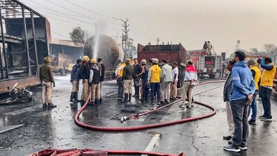 Firefighters extinguish the fire at the site of the accident after a truck loaded with a chemical collided with some other vehicles and caught fire on the Jaipur-Ajmer Highway, in Jaipur, Friday, Dec. 20, 2024. (PTI) Firefighters extinguish the fire at the site of the accident after a truck loaded with a chemical collided with some other vehicles and caught fire on the Jaipur-Ajmer Highway, in Jaipur, Friday, Dec. 20, 2024. (PTI)