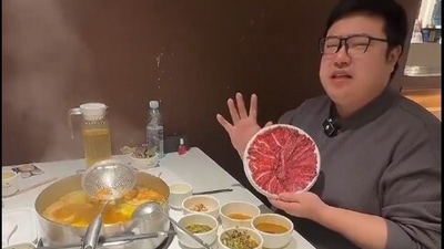 Chinese influencer's playful Trump impersonation effectively markets hotpot. (@stillgray/X)