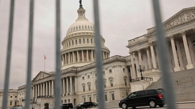 The dome of the Capitol is seen through a security fence on a day where a potential government shutdown looms during the holidays after a spending bill backed by Donald Trump failed in the US House of Representatives, on Capitol Hill in Washington, US. (REUTERS)