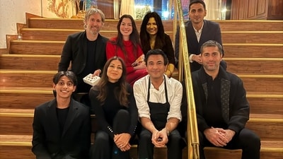 Vikas Khanna posed for a photo with Anne Hathaway outside his restaurant. Vikas Khanna posed for a photo with Anne Hathaway outside his restaurant.