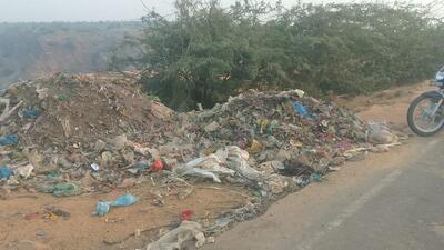 Waste illegally dumped on the Nuh-Tauru Road near the Aravallis in Gurugram on Thursday. (HT Photo)