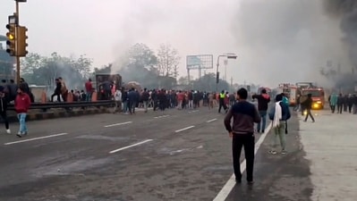 Jaipur: People gather near the site of a massive fire which broke out following a truck collision outside a petrol pump on Friday morning, (PTI) Jaipur: People gather near the site of a massive fire which broke out following a truck collision outside a petrol pump on Friday morning, (PTI)