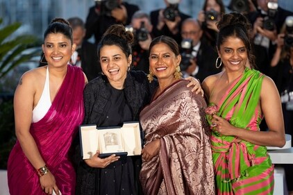 FILE - Filmmaker Payal Kapadia, second from left , winner of the grand prize for "All We Imagine As Light," poses with Divya Prabha, from left, Chhaya Kadam and Kani Kusruti after the awards ceremony at the 77th international film festival, Cannes, southern France, Saturday, May 25, 2024. (Photo by Scott A Garfitt/Invision/AP, File) (Scott A Garfitt/Invision/AP)