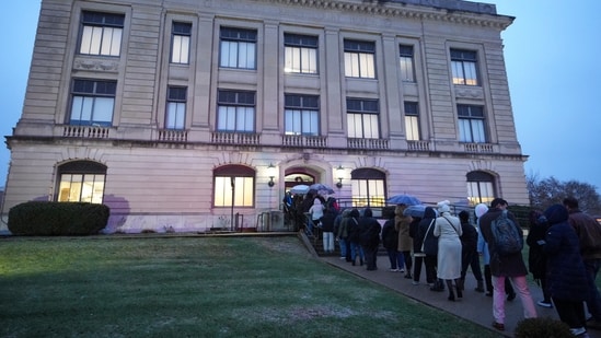 Spectators line up to enter the Carroll County Courthouse for the sentencing of Richard Allen, convicted in the 2017 killings of two teenage girls , in Delphi, Ind., Friday, Dec. 20, 2024. (AP Photo/Michael Conroy) (AP)