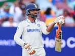 India's Ravindra Jadeja celebrates his half-century during the fourth day of the third test match against Australia, in Brisbane India's Ravindra Jadeja celebrates his half-century during the fourth day of the third test match against Australia, in Brisbane