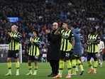 Manchester City's Spanish manager Pep Guardiola (C) and his players applaud their fans on the pitch after the English Premier League football match against Aston Villa.