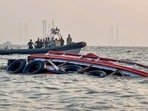 Rescue work underway after a ferry capsized off Mumbai coast when a Navy craft crashed into it on Wednesday. At least 14 passengers died in the crash. 