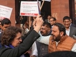 Congress MP Priyanka Gandhi Vadra and BJP MP Hemang Joshi with other INDIA bloc and NDA members during a protest in Parliament premises, in New Delhi, Thursday, Dec. 19, 2024. Congress MP Priyanka Gandhi Vadra and BJP MP Hemang Joshi with other INDIA bloc and NDA members during a protest in Parliament premises, in New Delhi, Thursday, Dec. 19, 2024.
