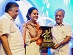 Thiruvananthapuram: Kerala Chief Minister Pinarayi Vijayan and state Minister of Culture and Youth Affairs Saji Cherian present the �Spirit of Cinema Award� to filmmaker Payal Kapadia during the closing ceremony of the International Film Festival of Kerala (IFFK), in Thiruvananthapuram, Friday, Dec. 20, 2024. (PTI Photo) (PTI12_20_2024_000454A) Thiruvananthapuram: Kerala Chief Minister Pinarayi Vijayan and state Minister of Culture and Youth Affairs Saji Cherian present the �Spirit of Cinema Award� to filmmaker Payal Kapadia during the closing ceremony of the International Film Festival of Kerala (IFFK), in Thiruvananthapuram, Friday, Dec. 20, 2024. (PTI Photo) (PTI12_20_2024_000454A)