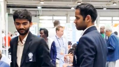D Gukesh and Arjun Erigaisi after the latter won the final round match against GM Jan Subelj of Slovenia at the 45th FIDE Chess Olympiad, in Budapest. (AP)