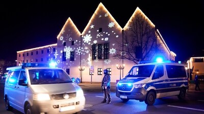 Germany car attack: A police officer guards at a blocked road near a Christmas Market after an incident in Magdeburg, Germany, on Friday. (AP)