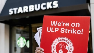Former employees and supporters join unionized Starbucks employees as they carry signs in support of a strike, outside of a Starbucks store in Arlington, Virginia, on November 16, 2023 (Saul Loeb/AFP) Former employees and supporters join unionized Starbucks employees as they carry signs in support of a strike, outside of a Starbucks store in Arlington, Virginia, on November 16, 2023 (Saul Loeb/AFP)
