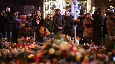 People stand at a makeshift memorial near the site of a car-ramming attack on a Christmas market in Magdeburg, eastern Germany, on December 21. (File image) (AFP) People stand at a makeshift memorial near the site of a car-ramming attack on a Christmas market in Magdeburg, eastern Germany, on December 21. (File image) (AFP)
