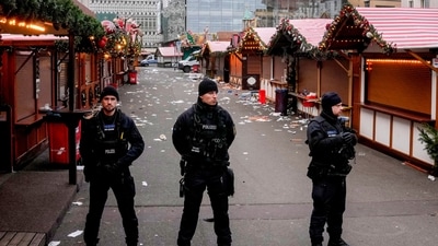 Policemen guard a Christmas Market, where a car drove into a crowd on Friday evening, in Magdeburg. (AP) Policemen guard a Christmas Market, where a car drove into a crowd on Friday evening, in Magdeburg. (AP)