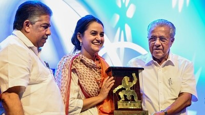 Thiruvananthapuram: Kerala Chief Minister Pinarayi Vijayan and state Minister of Culture and Youth Affairs Saji Cherian present the �Spirit of Cinema Award� to filmmaker Payal Kapadia during the closing ceremony of the International Film Festival of Kerala (IFFK), in Thiruvananthapuram, Friday, Dec. 20, 2024. (PTI Photo) (PTI12_20_2024_000454A) (PTI) Thiruvananthapuram: Kerala Chief Minister Pinarayi Vijayan and state Minister of Culture and Youth Affairs Saji Cherian present the �Spirit of Cinema Award� to filmmaker Payal Kapadia during the closing ceremony of the International Film Festival of Kerala (IFFK), in Thiruvananthapuram, Friday, Dec. 20, 2024. (PTI Photo) (PTI12_20_2024_000454A) (PTI)