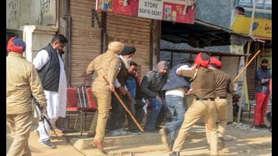 Police personnel try to control a clash between workers of political parties during MC elections in Patiala on Saturday. (PTI) Police personnel try to control a clash between workers of political parties during MC elections in Patiala on Saturday. (PTI)