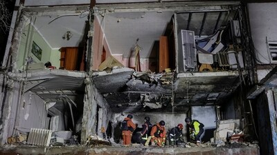 Rescuers work at a site of an apartment building damaged by Russian drone strike, amid Russia's attack on Ukraine, in Kharkiv, Ukraine. (REUTERS)