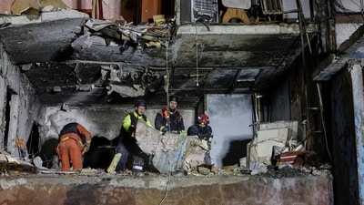 Rescuers work at a site of an apartment building damaged by Russian drone strike, amid Russia's attack on Ukraine, in Kharkiv, Ukraine. (REUTERS)