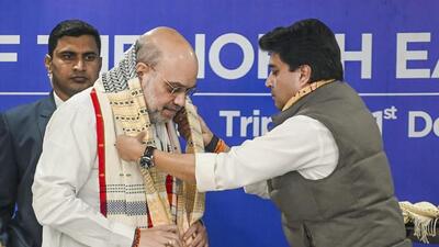 Union home minister Amit Shah being felicitated by Union minister for development of Northeastern region, Jyotiraditya Scindia, during the 72nd plenary session of the North Eastern Council, in Agartala, on Saturday. (PTI) Union home minister Amit Shah being felicitated by Union minister for development of Northeastern region, Jyotiraditya Scindia, during the 72nd plenary session of the North Eastern Council, in Agartala, on Saturday. (PTI)