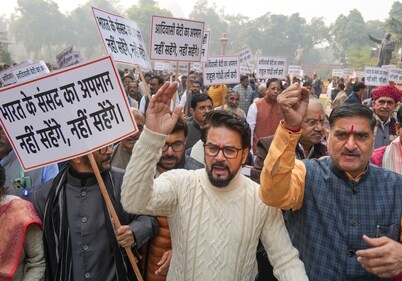 BJP MP Anurag Thakur with other party members during a protest against Congress leader Rahul Gandhi at Parliament complex, in New Delhi, Friday, Dec. 20, 2024. (PTI) BJP MP Anurag Thakur with other party members during a protest against Congress leader Rahul Gandhi at Parliament complex, in New Delhi, Friday, Dec. 20, 2024. (PTI)