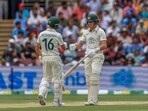 Nathan McSweeney fist bumps with batting partner Marnus Labuschagne. Nathan McSweeney fist bumps with batting partner Marnus Labuschagne.
