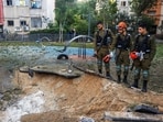 Israeli emergency services work at the scene of a missile strike that, according to Israel's military, was launched from Yemen and landed in Jaffa, south of Tel Aviv, Israel.
