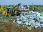 Medical and other waste from Kerala that was illegally dumped in Tirunelveli is being removed by Kerala authorities, in Tirunelveli, Tamil Nadu, on Sunday (PTI) Medical and other waste from Kerala that was illegally dumped in Tirunelveli is being removed by Kerala authorities, in Tirunelveli, Tamil Nadu, on Sunday (PTI)