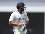 India's Rohit Sharma walks off the field after his dismissal by Australia's bowler Pat Cummins India's Rohit Sharma walks off the field after his dismissal by Australia's bowler Pat Cummins