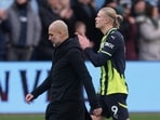 Manchester City manager Pep Guardiola and Erling Haaland look dejected after a match.