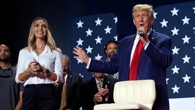 Republican presidential nominee former President Donald Trump speaks at a campaign town hall Oct. 4, 2024, in Fayetteville, N.C., as Republican National Committee co-chair Lara Trump listens. (AP Photo/Evan Vucci, File) (AP) Republican presidential nominee former President Donald Trump speaks at a campaign town hall Oct. 4, 2024, in Fayetteville, N.C., as Republican National Committee co-chair Lara Trump listens. (AP Photo/Evan Vucci, File) (AP)