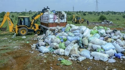 Medical and other waste from Kerala that was illegally dumped in Tirunelveli is being removed by Kerala authorities, in Tirunelveli, Tamil Nadu, on Sunday (PTI) Medical and other waste from Kerala that was illegally dumped in Tirunelveli is being removed by Kerala authorities, in Tirunelveli, Tamil Nadu, on Sunday (PTI)