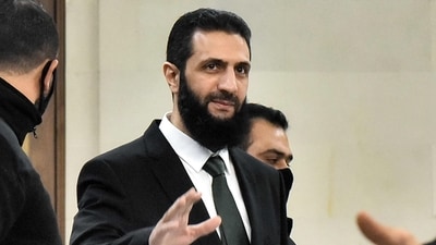 Syria's new leader Ahmed al-Sharaa (C) arrives for a meeing with visiting Druze officials from Lebanon's Progressive Socialist Party (PSP) in Damascus on December 22, 2024. (AFP) Syria's new leader Ahmed al-Sharaa (C) arrives for a meeing with visiting Druze officials from Lebanon's Progressive Socialist Party (PSP) in Damascus on December 22, 2024. (AFP)
