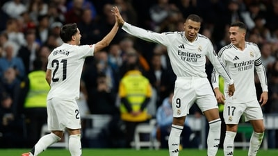 TOPSHOT - Real Madrid's Moroccan forward #21 Brahim Diaz (L) celebrates with Real Madrid's French forward #09 Kylian Mbappe scoring his team's fourth goal during the Spanish league football match between Real Madrid CF and Sevilla FC at the Santiago Bernabeu stadium in Madrid on December 22, 2024. (Photo by OSCAR DEL POZO / AFP) (AFP) TOPSHOT - Real Madrid's Moroccan forward #21 Brahim Diaz (L) celebrates with Real Madrid's French forward #09 Kylian Mbappe scoring his team's fourth goal during the Spanish league football match between Real Madrid CF and Sevilla FC at the Santiago Bernabeu stadium in Madrid on December 22, 2024. (Photo by OSCAR DEL POZO / AFP) (AFP)