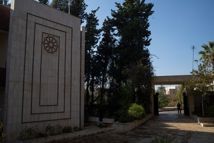 A man leaves a damaged property owned by ousted Syrian President Bashar Assad's family, in Qardaha, Syria, on Tuesday, (AP) A man leaves a damaged property owned by ousted Syrian President Bashar Assad's family, in Qardaha, Syria, on Tuesday, (AP)