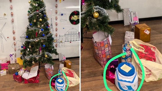 A blue and white tub of dahi with a yellow post-it note on it was placed under an office Christmas tree. (X/@ruag_rama)