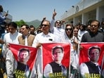 Parliamentarians of the Pakistan Tehreek-e-Insaf (PTI) party, carry posters of jailed former prime minister Imran Khan, during a protest outside the Parliament house in Islamabad on July 18, 2024. Parliamentarians of the Pakistan Tehreek-e-Insaf (PTI) party, carry posters of jailed former prime minister Imran Khan, during a protest outside the Parliament house in Islamabad on July 18, 2024.
