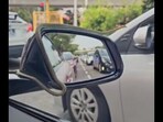 Family encountered a snake on their car in Singapore.