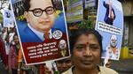 TMC members hold posters of B R Ambedkar during a protest rally in Kolkata on Monday. (Samir Jana/ Hindustan Times)