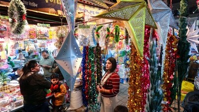People shop for decorations at a market ahead of Christmas festival, in Bhopal on Sunday. (ANI) People shop for decorations at a market ahead of Christmas festival, in Bhopal on Sunday. (ANI)