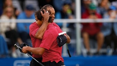 Tiger Woods of the United States with his son Charlie Woods and daughter Sam Woods walk on the first hole during the second round of the PNC Championship at Ritz-Carlton Golf Club on December 22 (Getty Images via AFP)