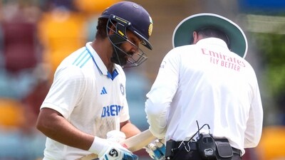 Rohit Sharma inspects his bat during the Gabba Test. (AFP) Rohit Sharma inspects his bat during the Gabba Test. (AFP)