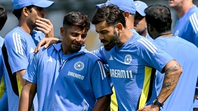Trust T Dilip to come up with the idea of something like Virat Kohli (R) reporting to Sarfaraz Khan (L) (AFP) Trust T Dilip to come up with the idea of something like Virat Kohli (R) reporting to Sarfaraz Khan (L) (AFP)