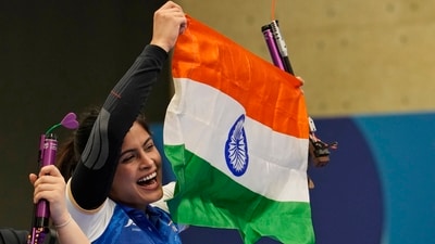India's Manu Bhaker celebrates with the Indian flag, in Paris. (AP) India's Manu Bhaker celebrates with the Indian flag, in Paris. (AP)